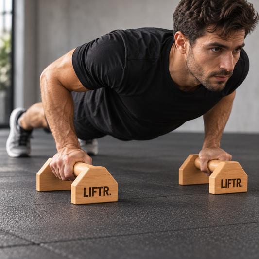 Athlete performing a push-up using LIFTR wooden parallettes