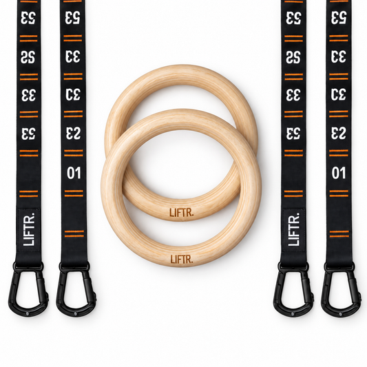 Two LIFTR wooden gymnastic rings with numbered quick-adjust hook straps