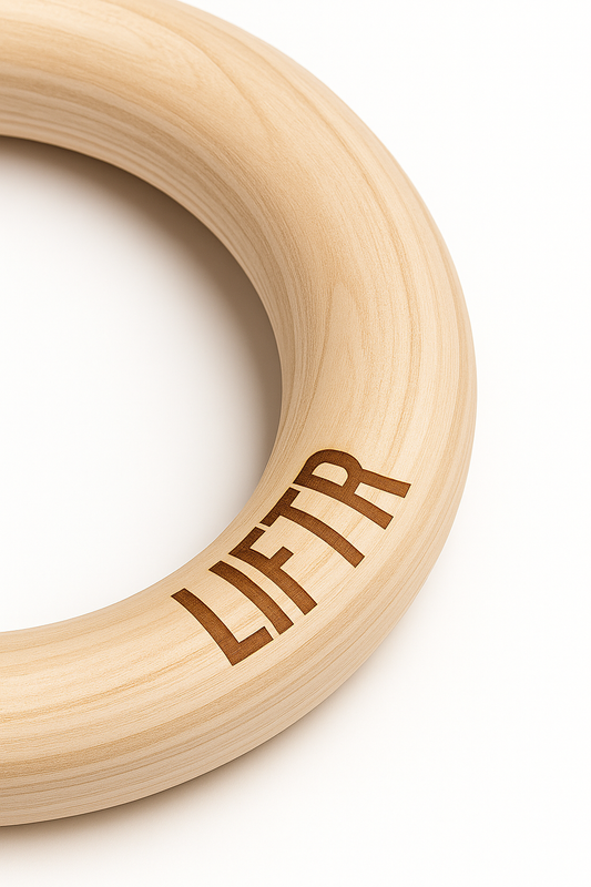 LIFTR gymnastic rings for weighted dips and muscle-up training — home gym setup