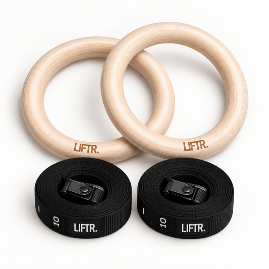 Two LIFTR wooden gymnastic rings with two rolled numbered buckle straps