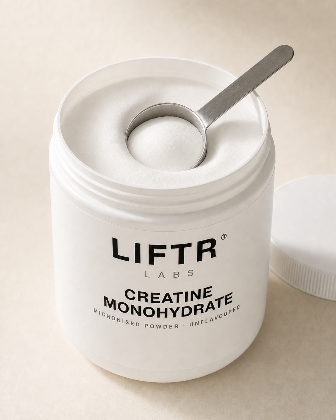Macro of micronised creatine powder and scoop
